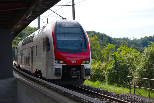 SBB CFF FFS passenger train at railway station of Swiss village of Glattfelden on a sunny late summer day. Photo taken September 7th, 2025, Zurich Glattfelden, Switzerland.