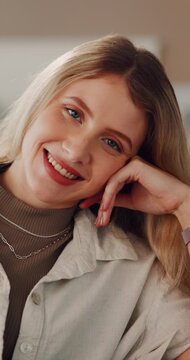 Face, woman and relax with smile in home for weekend break, peaceful morning and free time. Portrait, calm person and happy in apartment for comfortable rest, positive attitude and unwind on day off