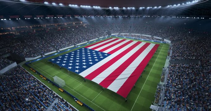 Professional Stadium With Soccer Game Championship With Flag of USA Spread Across Pitch Before Football Match Start. Cheering Crowds of Fans Ring the Arena During Ceremony. Aerial Static Wide Shot