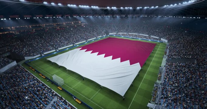 Professional Stadium With Soccer Game Championship With Flag of Qatar Spread Across Pitch Before Football Match Start. Cheering Crowds of Fans Ring the Arena in a Tense Spectacle. Aerial Static Shot