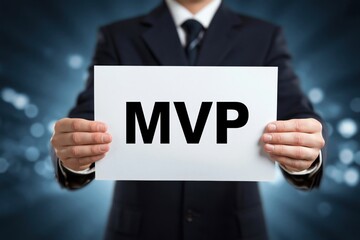 Obraz premium A startup founder holding a sign with the acronym MVP