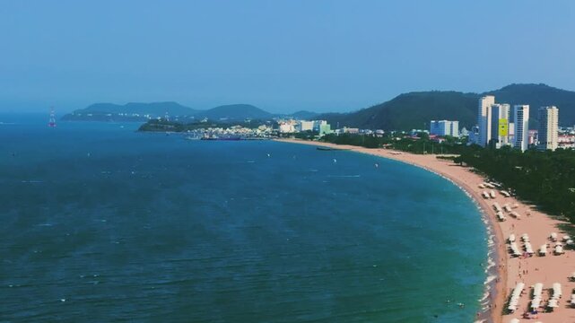 Aerial 4K parasailing adventure over turquoise ocean in Nha Trang Vietnam
the thrill of extreme water sports, the vibrant colors of the parachute, and the white wake of the boat against the blue sea