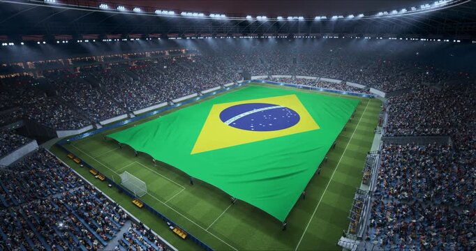 Professional Stadium With Soccer Game Championship With Flag of Brazil Spread Across Pitch Before Football Match Start. Cheering Crowds of Fans at Arena Anthem Ceremony. Aerial Static Shot
