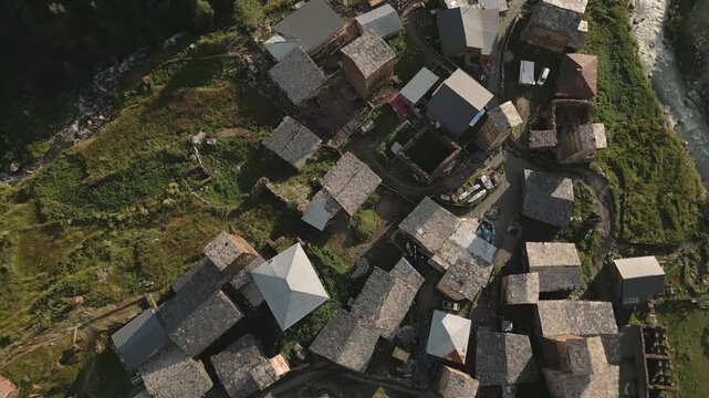 Aerial top circular view Ushguli village settlement and Svan towers in high caucasus mountains.UNESCO World Heritage Site. Svaneti Georgia. Chazhashi - most preserved village with svan towers