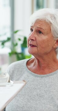 Senior, woman and cough with doctor for consultation, medical checkup or diagnosis in clinic. Elderly, female person or discussion with healthcare worker or clipboard for cure, help or health advice