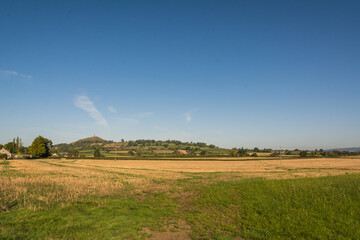 Fototapeta premium Historic St Michaels Tower on Glastonbury Tor Hill under Clear Blue Sky 