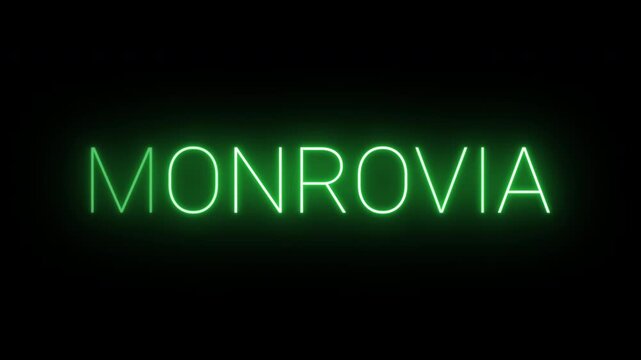 Flickering neon green glowing monrovia sign animated on black background