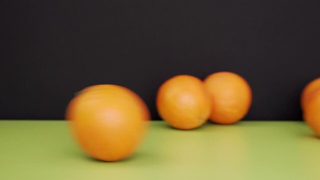 Group of oranges falling on a black background
