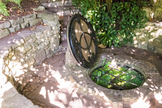 Ancient Chalice Well Lid with Vesica Piscis Symbol in Glastonbury Sacred Garden
