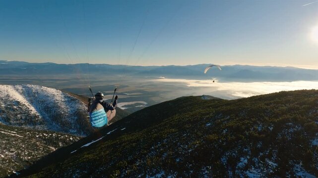 Paraglider Flying Peacefully Above Forest Mountains at Sunset, Paragliding Freedom