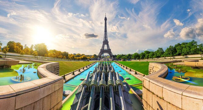 Iconic Eiffel Tower silhouette against a dramatic sunset sky at Trocadero, Paris, France