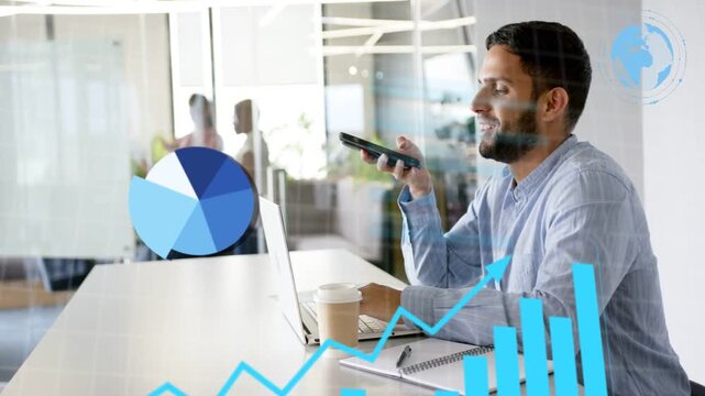 Man seated at desk dictating into smartphone and typing laptop, causing animated analytics charts