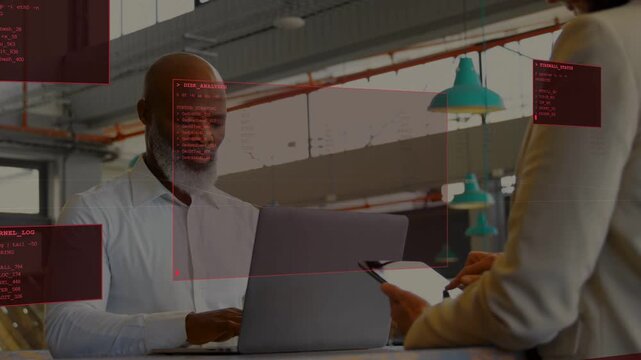Seated man typing while standing woman tapping tablet, creating red HUD data logs for business use
