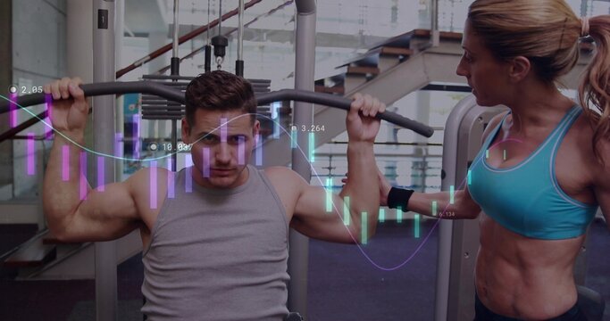 Guiding trainer assisting male using lat pulldown at gym, wearing turquoise bra, with data overlay