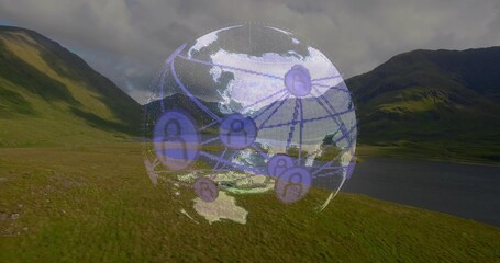 Obraz premium Hovering purple digital globe showing nodes over grassy valley, lake at right, cloudy mountains