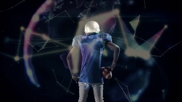 Male athlete facing away holding football while shards building into sports globe around him