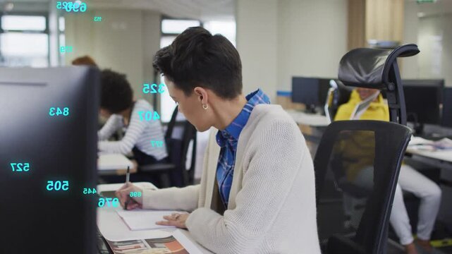 Shorthaired designer sketching, glancing at monitor pinging HUD overlays sweeping right for design