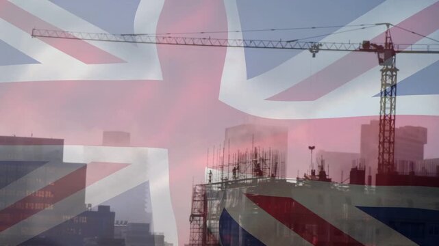 On play, Union Jack flowing across urban skyline, crane spanning frame, marking UK build progress