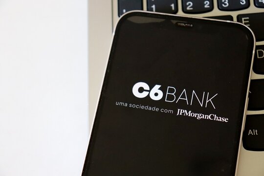 Salvador, Brazil - April 24, 2026: C6 Bank logo on a smartphone screen. JPMorgan Chase. C6 logo. 