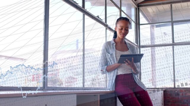 Woman leaning tapping tablet and swiping, making blue chart overlay shift while analyzing tech data