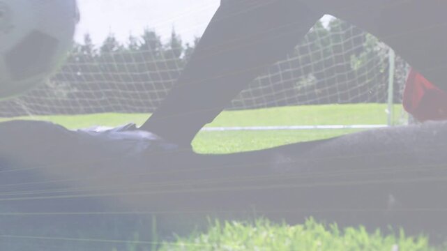 Soccer attacker sprinting, kicking ball, trying to score, keeper diving, ball rolling into goal