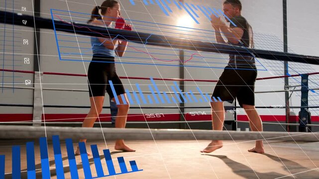 Boxing pair on drill cue pressing jabs while blue analytics charts tracking movement overlay ring
