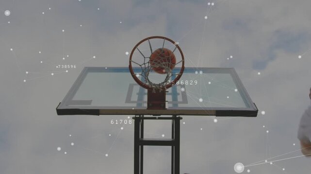 Hoop holding centered as right player bringing ball dueling other jumping shooting trying to score