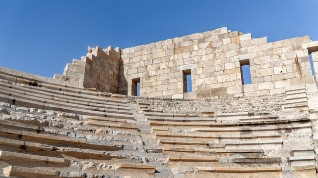 Stone seating tiers and stage wall of the Lycian League Assembly theater at Patara archaeological site, Antalya, Turkey, world's first democratic parliamentary building.