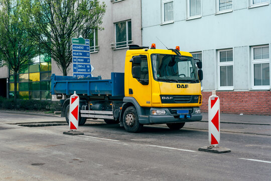 Prostejov, Czech Republic - April 18, 2026: Yellow DAF LF 45.250 dump truck at roadworks area, ulice Olomoucka