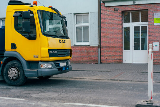 Prostejov, Czech Republic - April 18, 2026: Yellow DAF LF 45.250 truck parked at road work zone, ulice Olomoucka