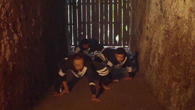 Pack of Creatures Crawling in a Dungeon Towards a Barred Gate
