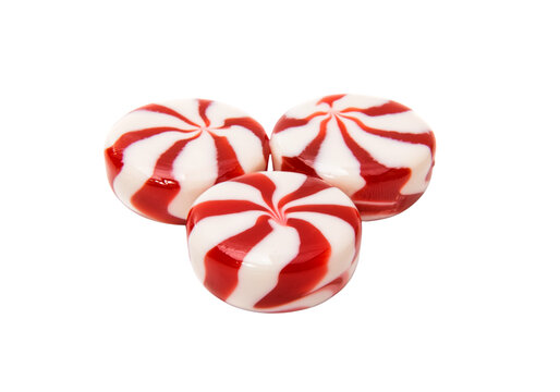 Three red and white striped peppermint candies, swirl mints isolated on transparent background PNG