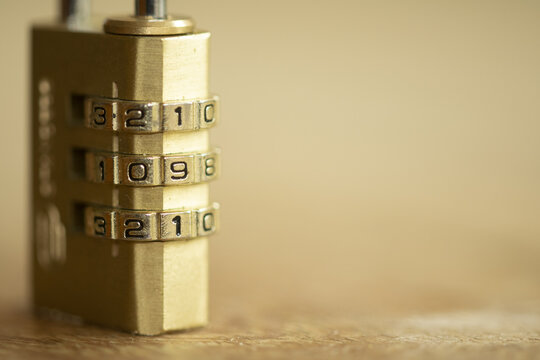 Brass combination padlock with numeric code for security and data protection
