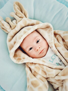 baby in giraffe robe