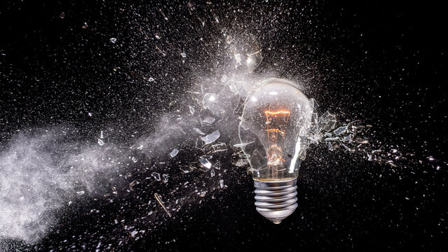 Real Light bulb exploding creating shattered glass impact