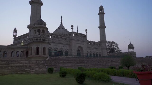 Bara Imambara a Mosque in Lucknow, Uttar Pradesh. Tourists at historic palace facade with grand steps