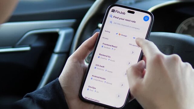 Find your next tech role on the go. User browsing software developer jobs like React and Swift on a mobile app inside a car. Perfect for recruitment, IT careers, and digital nomad content. High