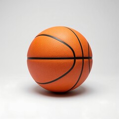 Fototapeta premium A basketball is isolated against a neutral background. The orange sphere, marked with black lines, represents a classic sports equipment