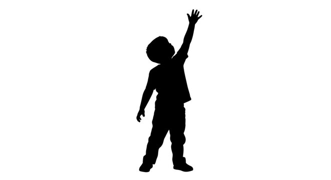 Child reaching upwards with arm raised a dramatic silhouette