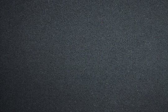 High resolution black polo shirt pique cotton fabric texture background