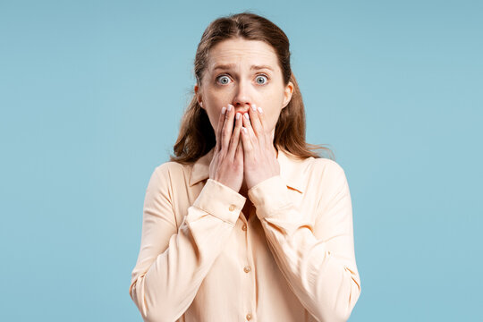 Woman covering mouth feeling shock and surprise