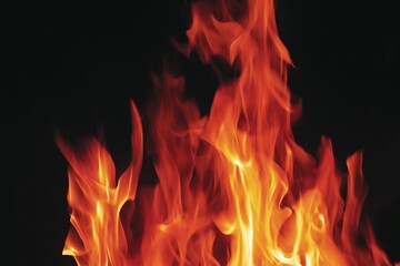 Fototapeta premium Colorful Flames Dance in the Dark Background During a Fire Event at Night