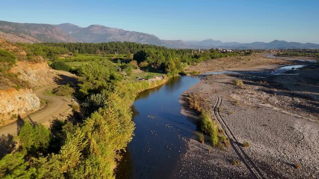 Aerial view of Nam Nam stream winding through forested mountains in Mugla, Mediterranean Turkey.