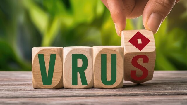 Hand Placing Wooden Block with Virus Symbol Next to VRUS Letters on Rustic Wooden Surface