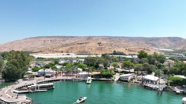 Aerial Panorama of the Sea of Galilee (Kinneret) Shoreline Featuring Resorts, Green Water, and Arid Mountains