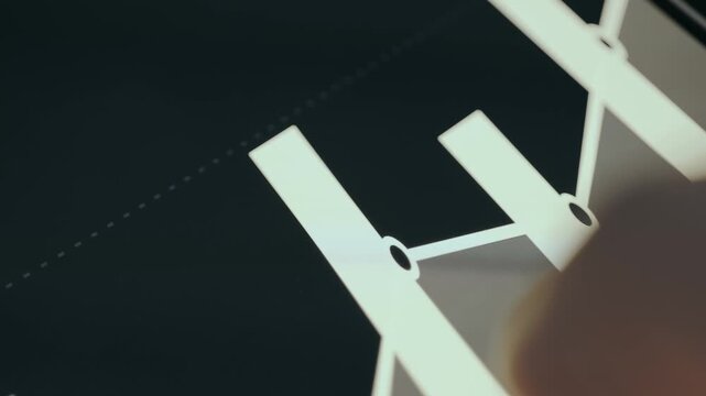 Finger controlling a financial data graph on screen