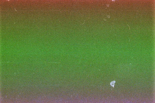 Blank grained film strip texture background with heavy grain, dust and light leak