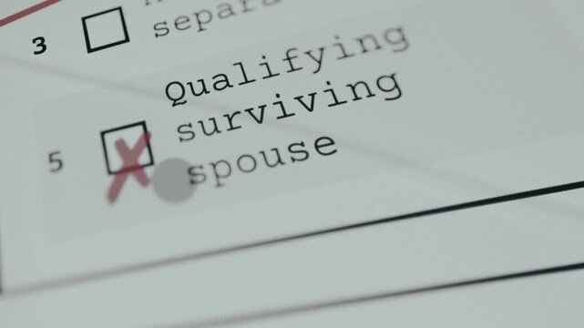 Person marking the tax filing option for a qualifying surviving spouse