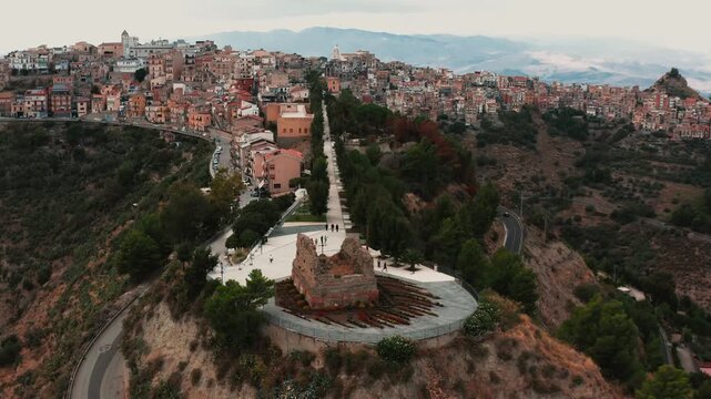 Drone through the main promenade of Centuripe Sicily with sweeping city views below