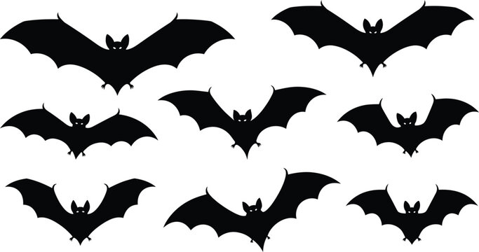 Collection of black bat silhouettes with glowing eyes on a white background, flying